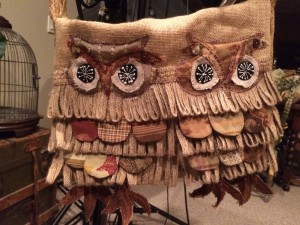 Two owls perched on messenger bag