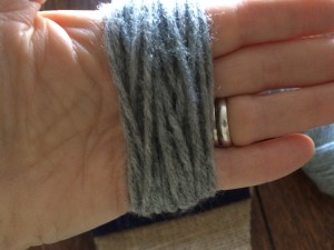 Yarn wrap for making pom-pom for stocking toe