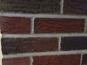 close up of bricks before paint treatment