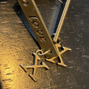 “Love X” dangle handmade for pierced ears in an antique bronze color metal